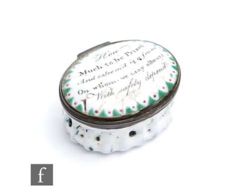 A late 18th to early 19th Century Bilston type enamel pill or patch box decorated to the slightly domed cover with the motto 