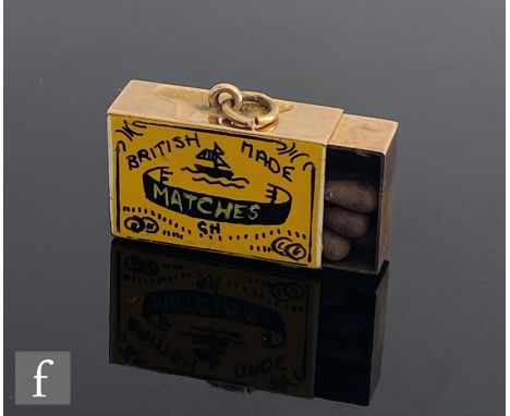 A 9ct hallmarked novelty charm modelled as a box of British Made matches with yellow and black enamel logo to front and strik