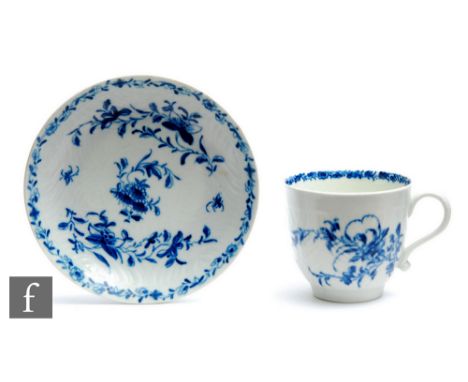 An 18th Century Worcester coffee cup and saucer decorated in the blue and white Feather Mould Floral pattern, underglaze cres