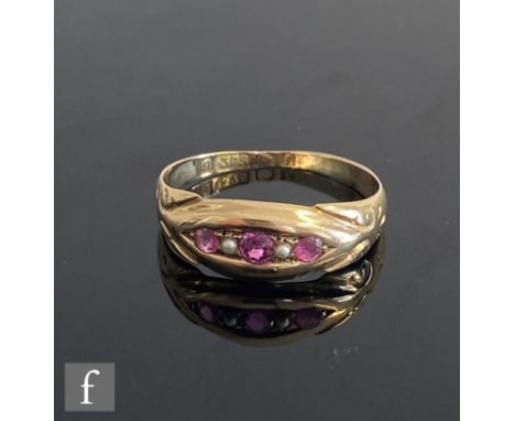 A 9ct hallmarked five stone ruby and split pearl boat shaped ring, alternating stones to scroll detailed shoulders, weight 1.