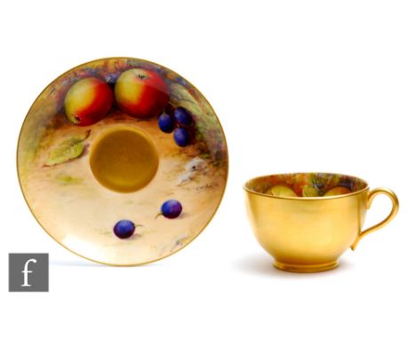 A Royal Worcester Fallen Fruits cabinet cup and saucer decorated by Austin, the interior of the cup&nbsp; and the saucer deco