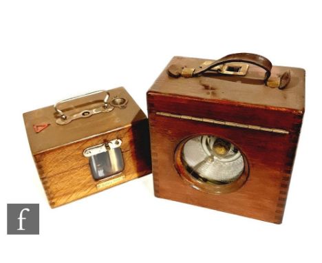 A 20th Century pigeon racing clock, the glass door etched Toulet Imperial, and a similar clock with German movement. (2) 