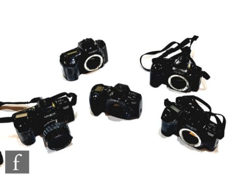 A collection of Minolta cameras, to include Dynax 7000i (no lens), Dynax 7000i with 35-80mm 1:4 (22) - 5.6 Minolta zoom lens,