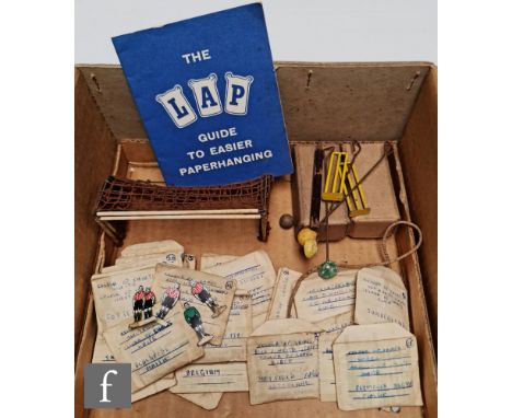 A collection of early Subbuteo, to include a quantity of card, plastic and homemade teams, bases, goals and balls. 