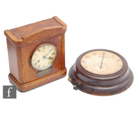 A Smiths brown Bakelite circular wall clock with large seconds dial, width 34cm, and an oak cased mantle clock, height 30cm. 