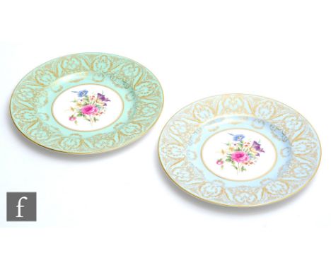 Two later 20th Century Royal Worcester cabinet plates each decorated with a hand painted floral spray to the central well wit