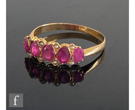 A 9ct ruby and diamond ring five oval claw set rubies detailed with four pairs of spacing diamonds set between, weight 1.2g, 