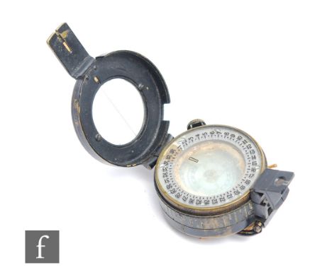 A World War Two pocket compass by T.G.Co Ltd No 2279224, 1943 MKIII. 
