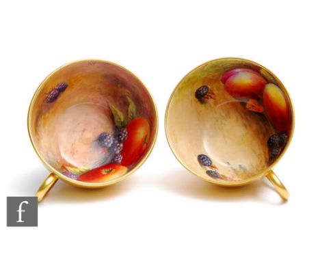 Two Royal Worcester Fallen fruits cabinet cups both with hand painted decoration to the interior, the first by H. Stinton wit