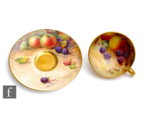 A matched miniature Royal Worcester Fallen Fruits cabinet cup and saucer, the cup decorated by Flexman to the interior with h