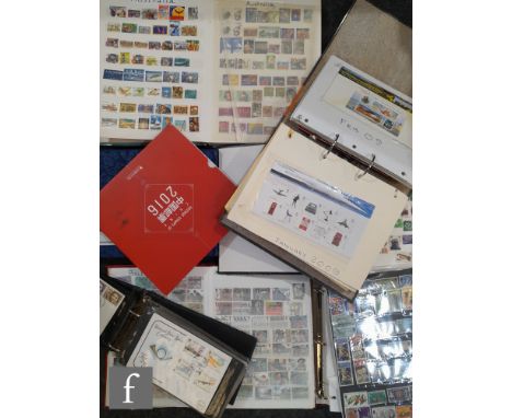 An album of Queen Elizabeth II presentation packs, together with eight albums of used world stamps and first day covers. (qty