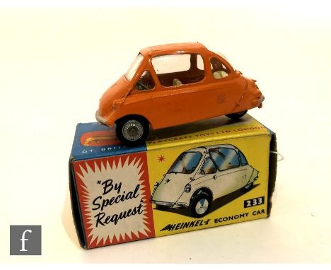 A Corgi 233 Heinkel Economy Car diecast model in orange with lemon yellow interior and cast hubs, boxed. 