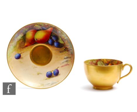 A Royal Worcester Fallen Fruits cabinet cup and saucer decorated by Austin, the interior of the cup and the saucer both decor