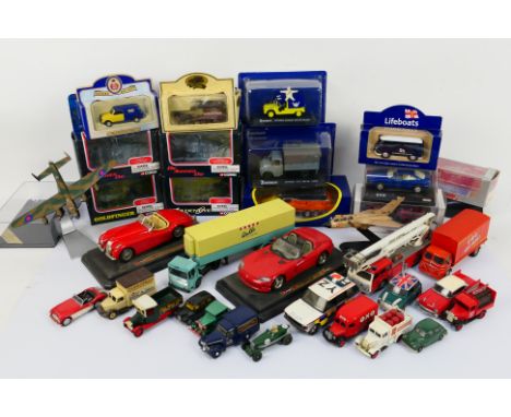 Corgi - Lledo - Bburago. A selection of Twenty-nine boxed and loose diecast model cars, trucks, planes and Seven empty boxes.