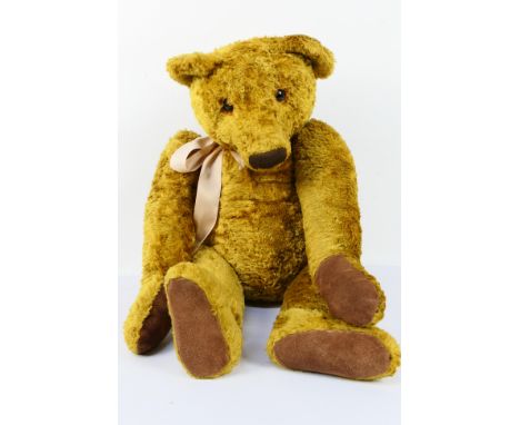 Unknown Maker - A large blonde/gold coloured mohair bear - Bear has metal joints, glass eyes, stitched nose, mouth and paws. 