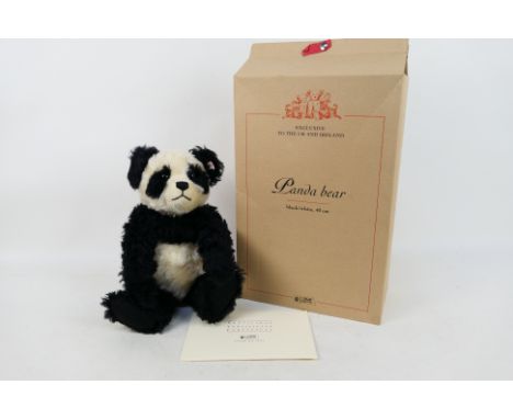 Steiff - A limited edition boxed Panda Steiff bear - The #661013 black and white bear has white buttoned Steiff label on its 