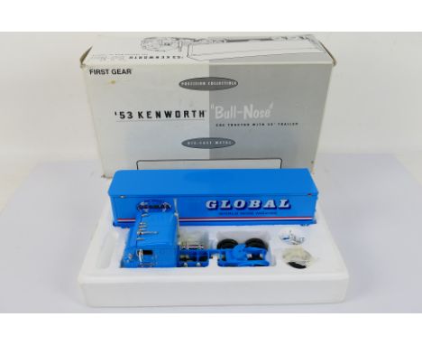 First Gear - A boxed 1953 Kenworth Bull Nose COE tractor unit with 35 foot box trailer in Global livery in 1:34 scale. The mo