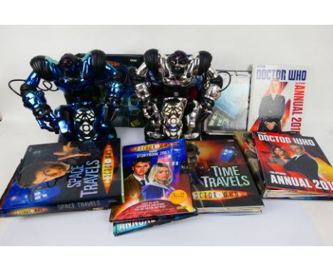 WowWee, BBC - Lot includes 2 x silver and blue-coloured WowWee Robosapien robot figures. 13 x Doctor Who books and annuals. A