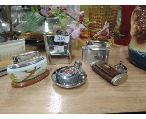 A selection of vintage drinking and smoking items including Mozda table lighter