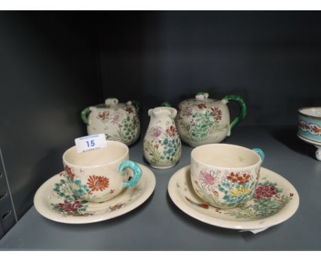 A vintage hand decorated oriental design part tea service 