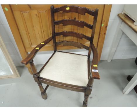 A mid 20th Century ladder back carver chair