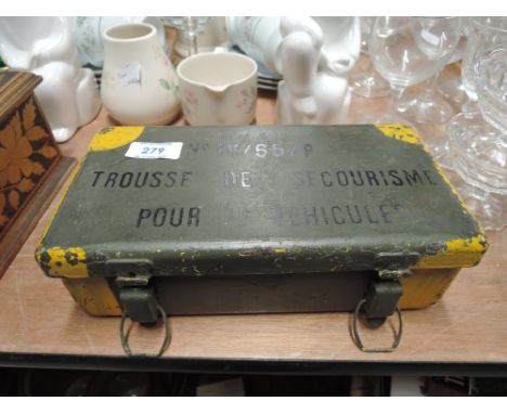 A World War II French first aid kit for vehicles, metal container with replacement U.S. Army first aid dressings