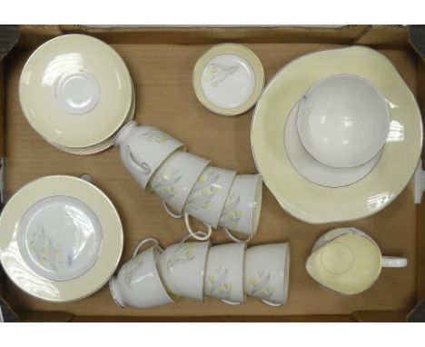 Susie Cooper Bone China part tea set floral pattern on pale lemon ground to include eight teacups, eight saucers, eight side 
