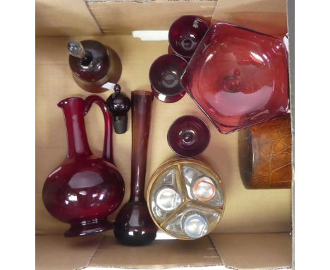 Collection of cherry red glass to include footed glass decanter, mini flower vase, footed bowl, three small glasses, bell and