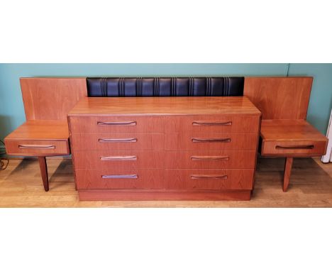 A mid 20th century teak chest of eight drawers, raised on plinth base, 140cm x 76cm x 45cm together with a mid 20th century t