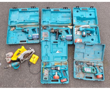 Cased Makita power tools to include two BHR200 drills, a 5621 RD 165mm circular saw, a 8390D and 8433D drills, together with 