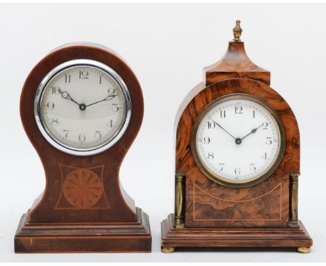 A 20th century walnut cased French mantle clock, with brass columns and brass finial, white dial with black Arabic numerals, 