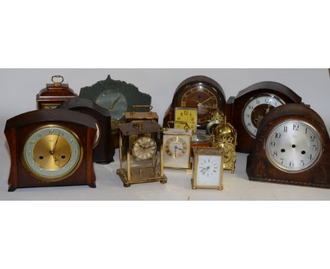A collection of early 20th century century clocks to include brass cased lantern clocks, bulkhead clocks together with assort