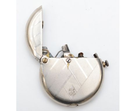 A 1920s Art Deco Thorens pocket cigarette lighter, having nickel plated case with engine turned decoration, petrol filled wit