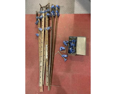 Seven metal Sash clamps and maples sash clamp parts. 137cm overall