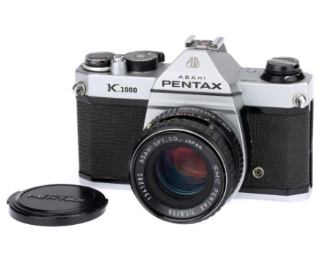 An Asahi Pentax K1000 SLR Camera,chrome, with SMC Pentax f/1.8 55mm lens, body, G-VG, shutter working, some haze to the finde