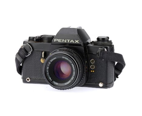 A Pentax LX 35mm SLR Camera,black, body G, shutter working, LEDs illuminate correctly, Automatic speeds selected seem reasona