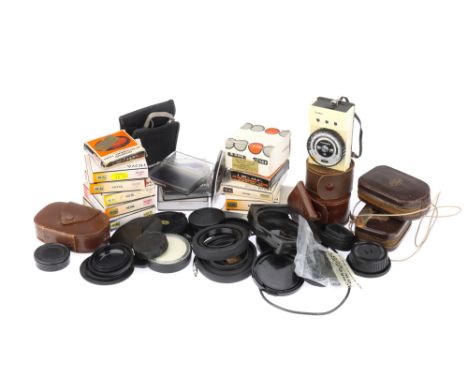 A Good Selection of Camera Accessories,to include a range of Hoya Filters, a selection of untested light meters, together wit