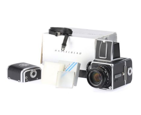 A Hasselblad 500c/m Medium Format SLR Camera,chrome, body VG-E, shutter working, together with a Zeiss Planar f/2.8 80mm, bod