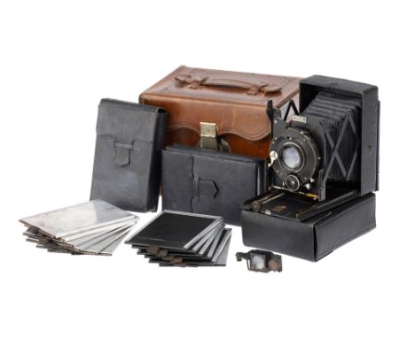 An Adams Vesta Folding Bed Camera Outfit,6.5 x 9cm format, body G, with Zeiss Tessar lens, optics F, with some internal fungu