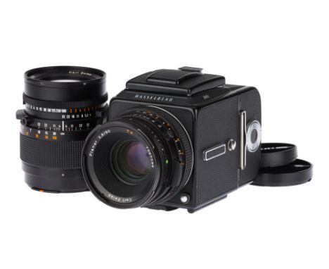 A Hasselblad 501C Medium Format Camera,black, serial no. 17EI11830, with Carl Zeiss CF Planar T* f/2.8 80mm lens, black, seri