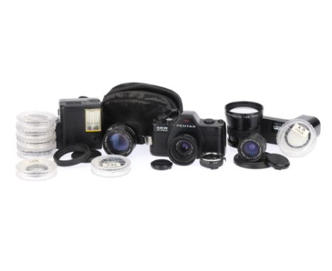 A Pentax Auto 110 Super 110 Cartridge SLR Camera Outfit1982, black, serial no. 2577659, with a Pentax-110 f/2.8 24mm lens, sh