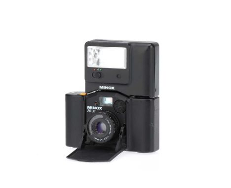 A Minox 35 GT 35mm Sub-Miniature Camera,black, body G, shutter untested, with Minox FC 35 flash unit, untested Note: Lot impo