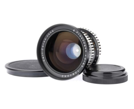 A Carl Zeiss Jena f/2.8 65mm Camera Lens,black, body G-VG, optics F, some strong haze present, in maker's original box with f