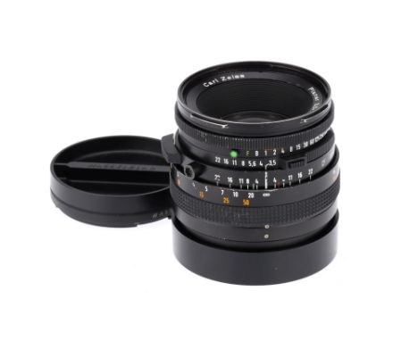 A Carl Zeiss Planar CF f/3.5 100mm Camera Lens,black, body F, some wear to lens body, grip loose, optics G, some dust present