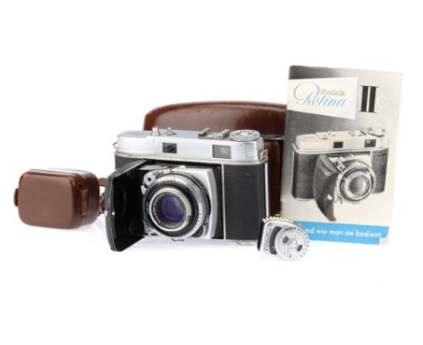 A Kodak Retina IIC 35mm Folding Rangefinder Camera, chrome, body G, shutter working, RF patch visible, the viewfinder has a l