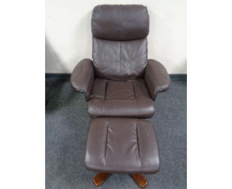 A brown leather manual adjustable reclining armchair with footstool 