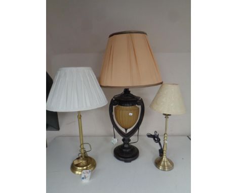A contemporary ornate table lamp with shade and two further table lamps 