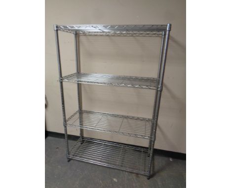 A set of metal four tier shelving 
