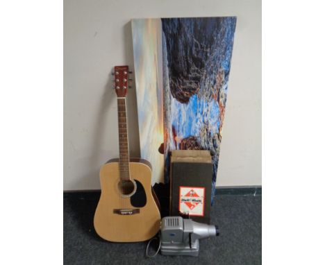 A Cheetah acoustic guitar, wall canvas, vintage Monopoly game and a Geome projector 