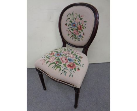 A beech framed occasional chair in tapestry fabric 